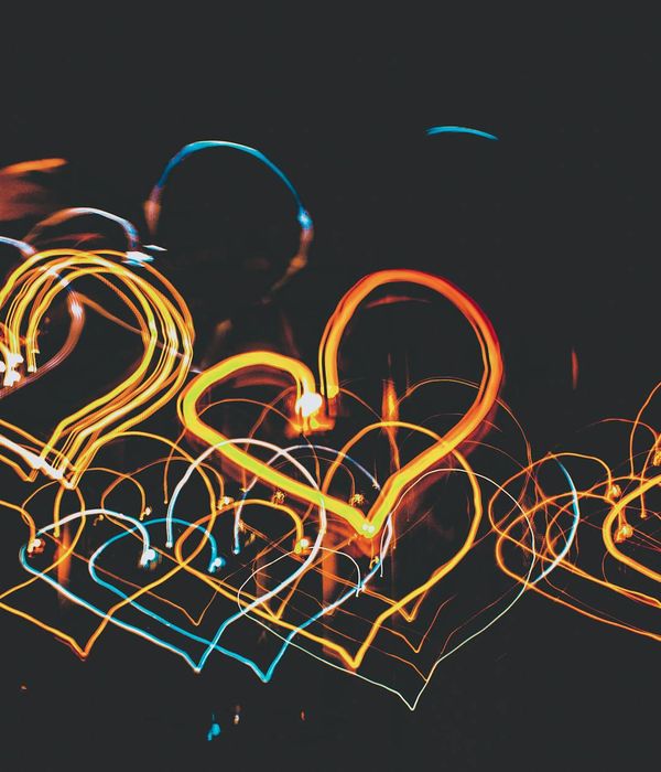 Abstract glowing geometric shapes representing dynamic movement and energy